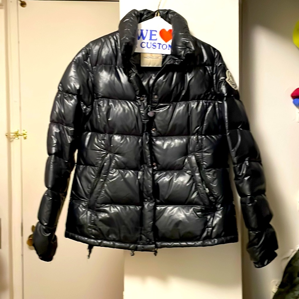 Worn and slightly torn moncler winter coat